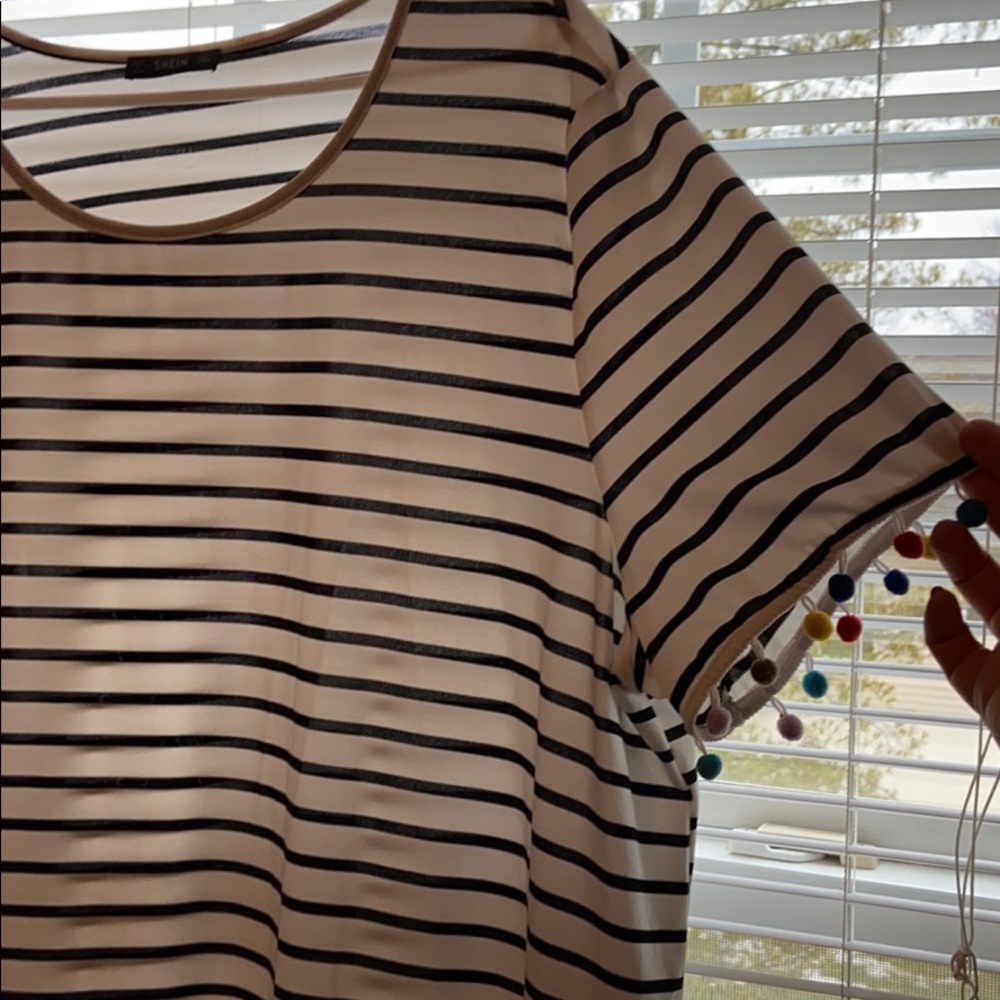 Striped dress with pompoms